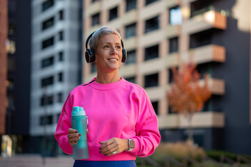 Woman enjoying urban workout break with music