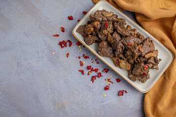 Spicy Pan-Fried Liver with Chili Flakes on a Plate