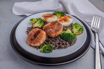 Nutritious Quinoa Bowl with Broccoli, Boiled Eggs, and Savory Patties