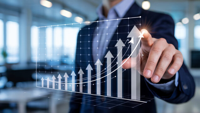 Modern business professional pointing to a dynamic growth chart representing financial success and positive trends in a vibrant corporate office