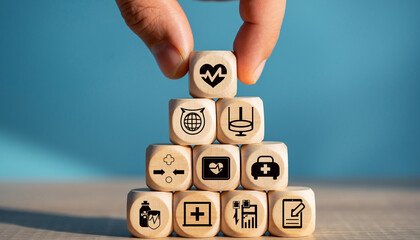 Wooden blocks stacked in a pyramid shape with health icons.
