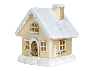 Miniature snow-covered house with warm lights.