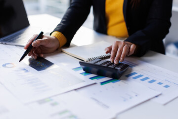 Accounting company provide finance and taxation planning for profitable cash flow, Auditor accountant working in office, analyze financial data and accounting record with calculator.Insight.