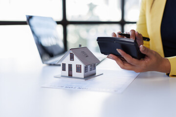 Mortgage Real Estate Broker presenting and advised to model home and building project detail in the...