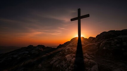 Silhouette of a Cross on a Rocky Hill at Sunset