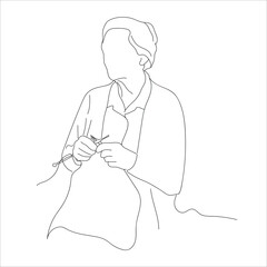 woman embroidering cloth. A woman embroiders on fabric