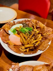 Grilled beef, onsen egg, and shimeji mushroom