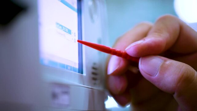Industrial Control Panel Touchscreen Interface with Red Stylus