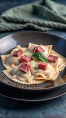 Creamy Alfredo sauce envelops tender salami and mozzarella ravioli in a rich, indulgent Italian dinner
