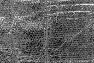 Close-up of bubble wrap texture in gray monochrome patterned surface