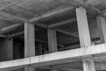 Concrete structure under construction with exposed beams and columns