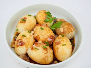 Son in Law Eggs is in a cup placed on a white background. It looks delicious. Thai food that I made myself and it is delicious.