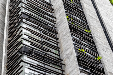 Modern architectural design with green elements on contemporary building facade