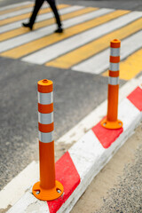 Pedestrian crossing with orange safety cones on urban road