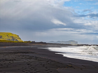 Black volcanic sand beach and cliffs in Vik i Myrdal Iceland
