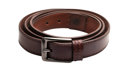 A coiled brown leather belt with a silver buckle on a black background in a studio setting