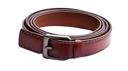 Closeup of a rolled brown leather belt with a silver buckle on a black background showing the details