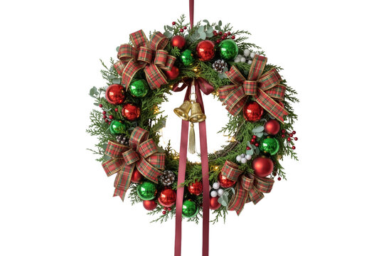 Festive christmas wreath with plaid ribbons, ornaments and bells