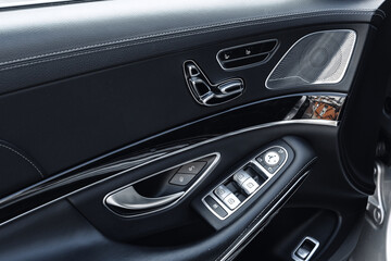 Fototapeta premium Detailed view of luxury car interior showcasing modern controls and design elements