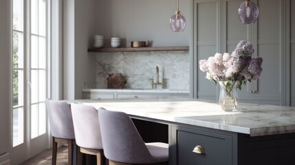 Modern kitchen with a large island in the center. the island has a white marble countertop with a vase of purple flowers on top. there are four gray barstools with wooden legs in front of the island.