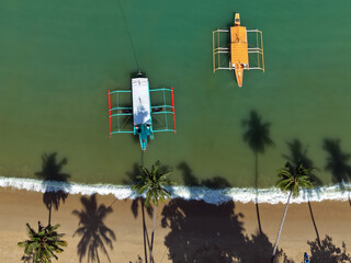 Aerial view of outrigger boats and beach, Palawan, The Philippines