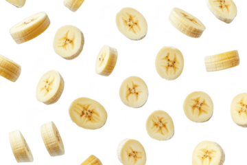 A and fresh arrangement of sliced bananas scattered on a clean white background. their natural texture and color. ideal for food-related content and recipes