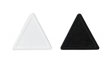 Two triangular shapes. one white and one black. placed side by side on a clean white background. contrasting textures and colors. ideal for design or educational purposes