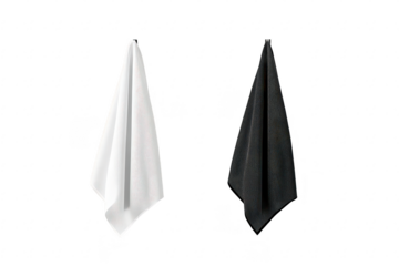 A minimalist display of a white and black towel hanging on a smooth wall. contrasting colors and textures. ideal for interior design inspiration or product presentation