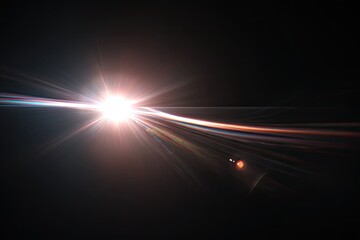 Bright starburst effect with lens flares against a dark background, radiating light streaks