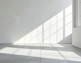 Obraz premium Bright room, light streams through window onto bare wall