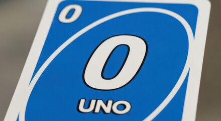 Close-up capturing the vibrant blue card featuring a prominent numeral zero character