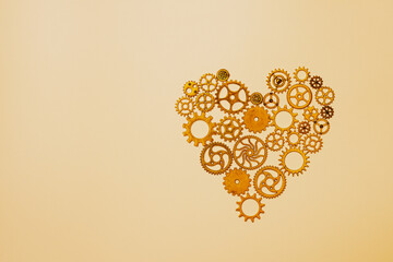 Love and connection concept with golden gear heart, copy space.