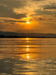 Golden Sunset Reflecting on Calm Water
