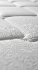 Close-up perspective showcasing the pristine white mattress surface details and texture
