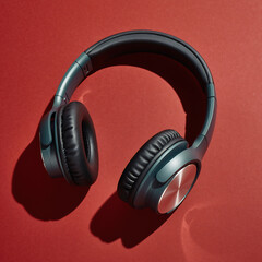 Modern Teal Headphones on Red Background for Audiophiles