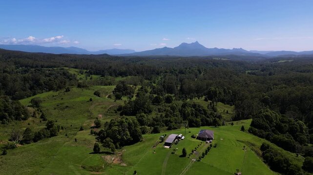 Left to right aerial view of Mt Warning, Wollumbin on a sunny day, Northern New South Wales, Australia.