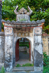 Obraz premium Gate of temple of mother (Chua Ba Mu) in Hoi An, Vietnam. Hoi An is noted since 1999 as a UNESCO World Heritage