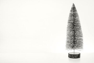 Decorative Christmas tree on a white background close-up with a place for the text. Color of the Year 2026, Cloud Dancer.