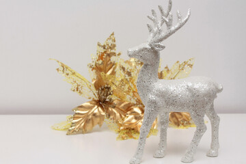 Elegant reindeer with Christmas ornament. Minimalist Christmas decoration