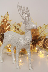 Minimalist Christmas decoration on a floor shelf with reindeer and lights