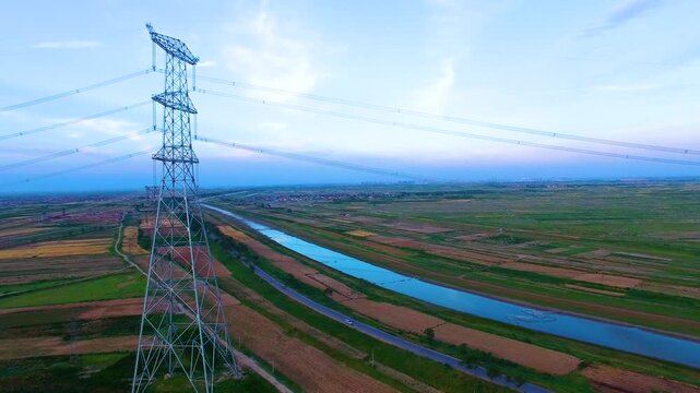 High Voltage 227kV Transmission Tower Aerial View Over Rural Farmland