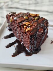 chocolate cake on a plate, sweet dessert bakery brownie cake