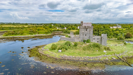Aerial drone view of Dunguaire Castle, a 16th century tower house top view from above, historical castle in Galway Bay, Ireland