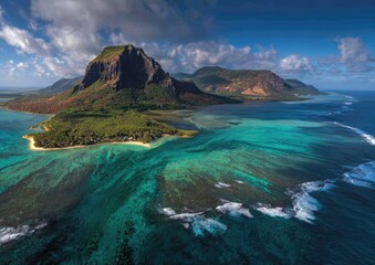 Aerial view of a stunning island with mountain, lush forest, and crystal clear blue ocean