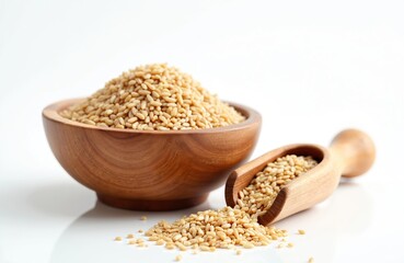 Fototapeta premium Wooden bowl and scoop filled with raw grains. Pile of organic wheat seeds for cooking healthy meals. Natural cereal kernels ready for use as ingredient.