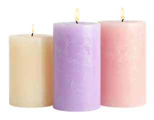Lit pastel candles cream, lilac, and pink glow together