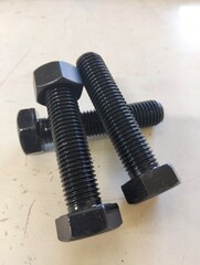 Black threaded steel bolt
