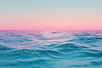 Obraz premium Expansive view of a tranquil blue ocean under a vibrant pink sky during sunset highlighting the beauty of nature's palette