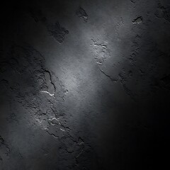Dark textured surface with dramatic lighting and rough edges.