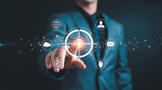 Businessmans hand pointing at a glowing target icon amidst a network of digital business solutions - Powered by Adobe